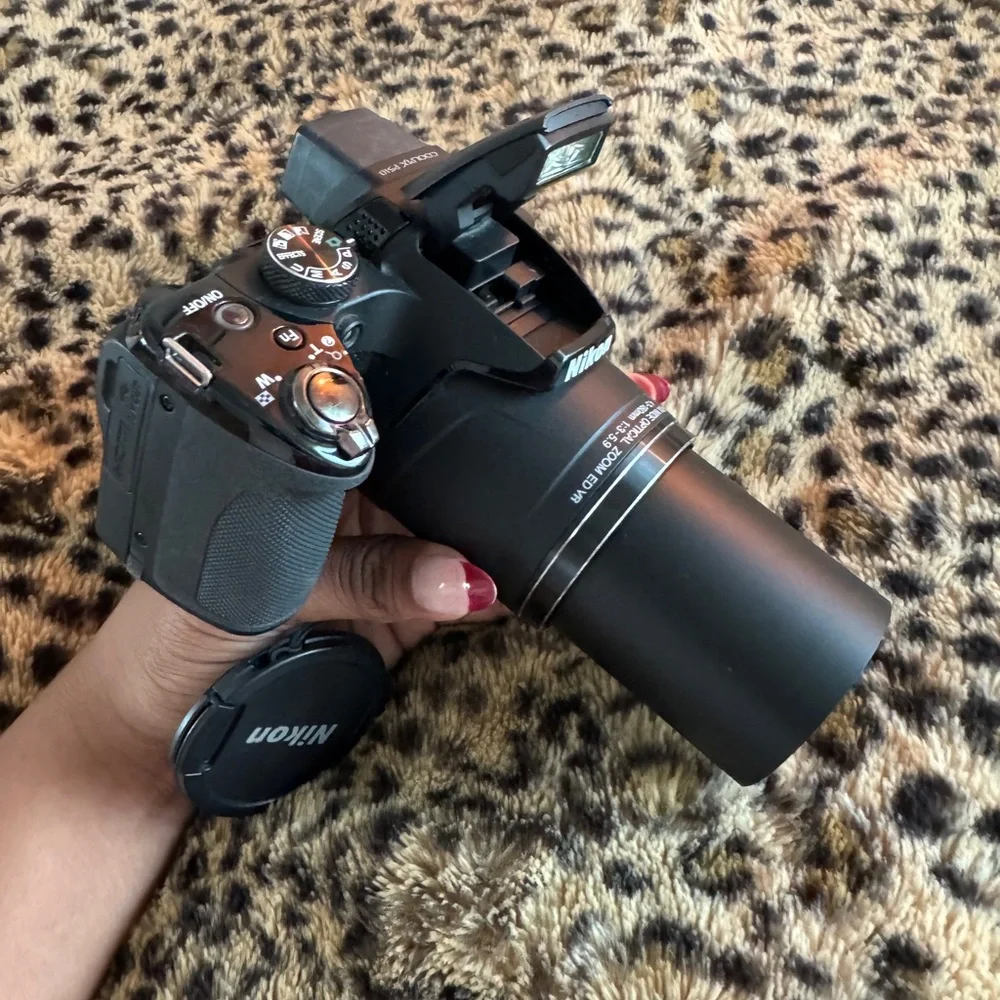 Nikon Black Camera with White Accessories